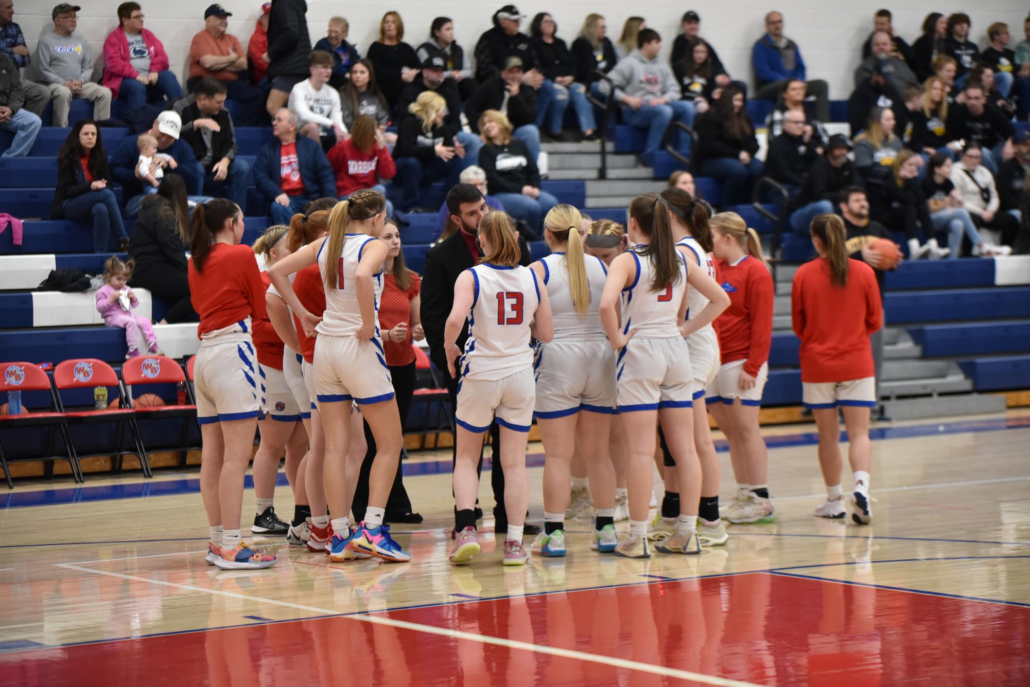 The team huddles before the playoff game against the Knights of Moshannon Valley.