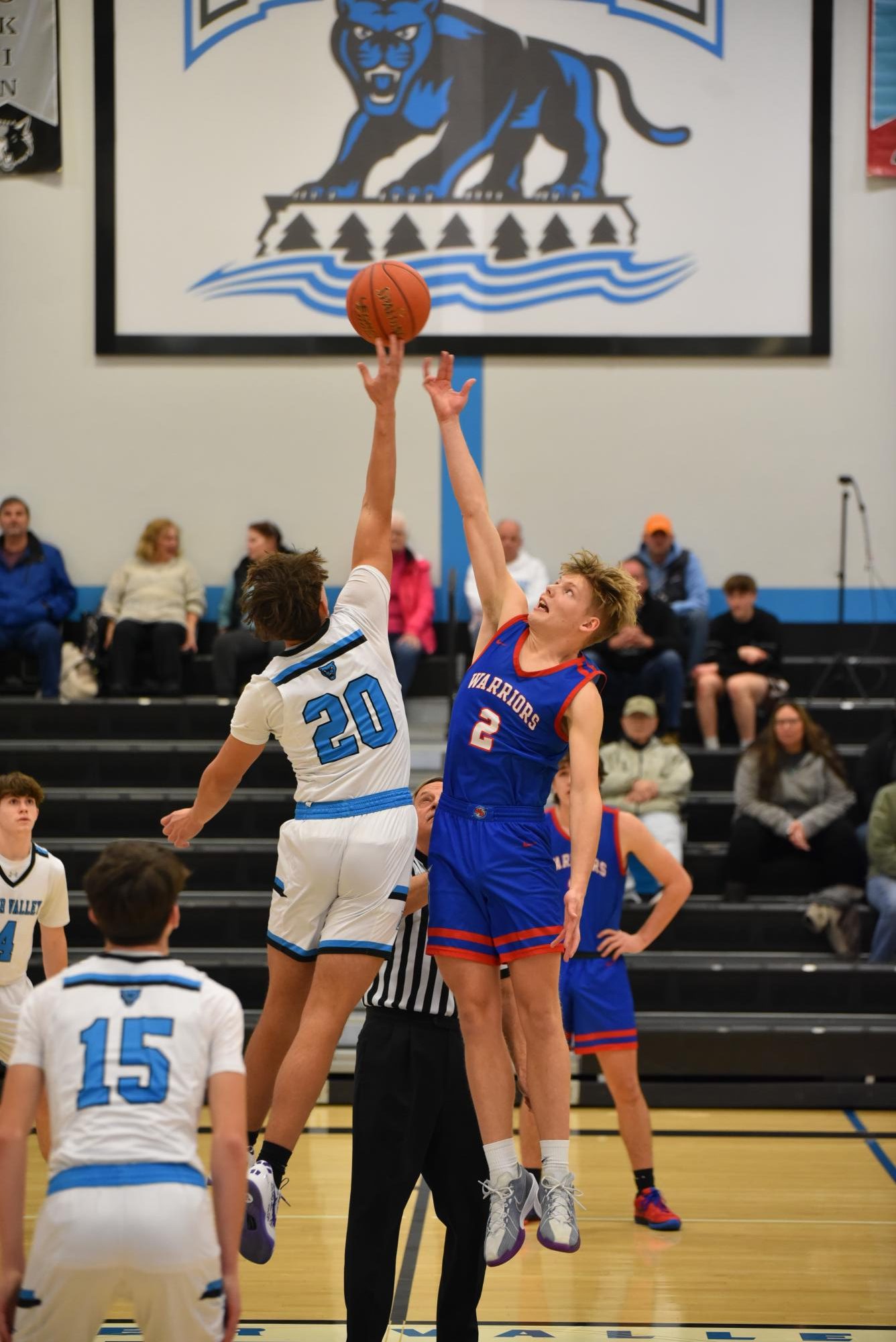 Joel Evans jumping up to get the ball during the tip-off against River Valley. 
