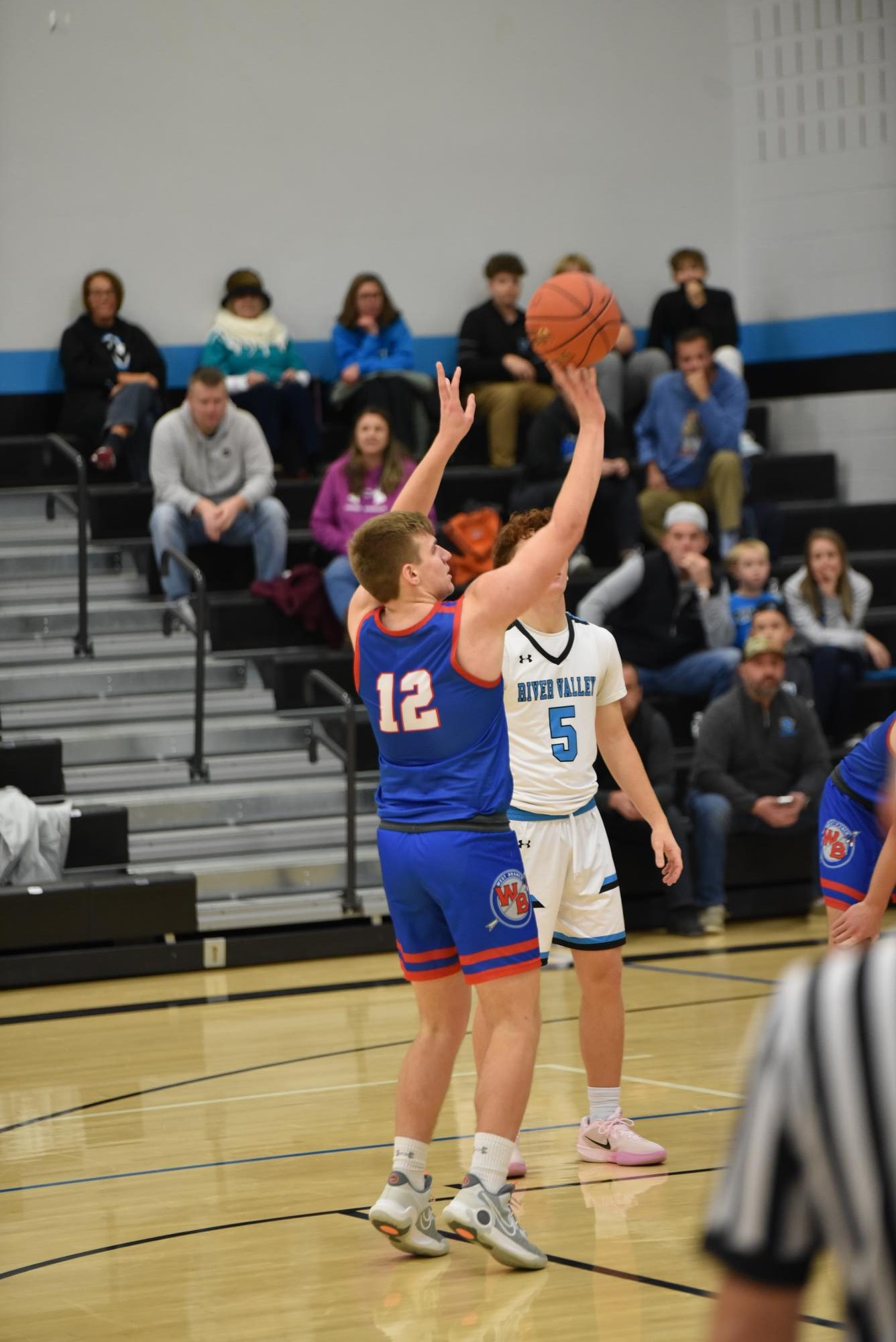 Owen Koleno shooting a foul shot during a game against River Valley.