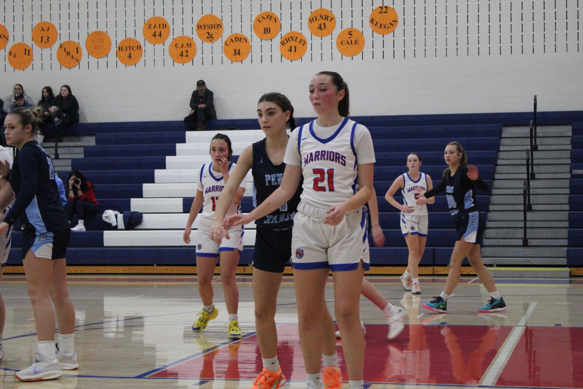 Number 21, Lily Williams awaits an inbound pass from her teammate.