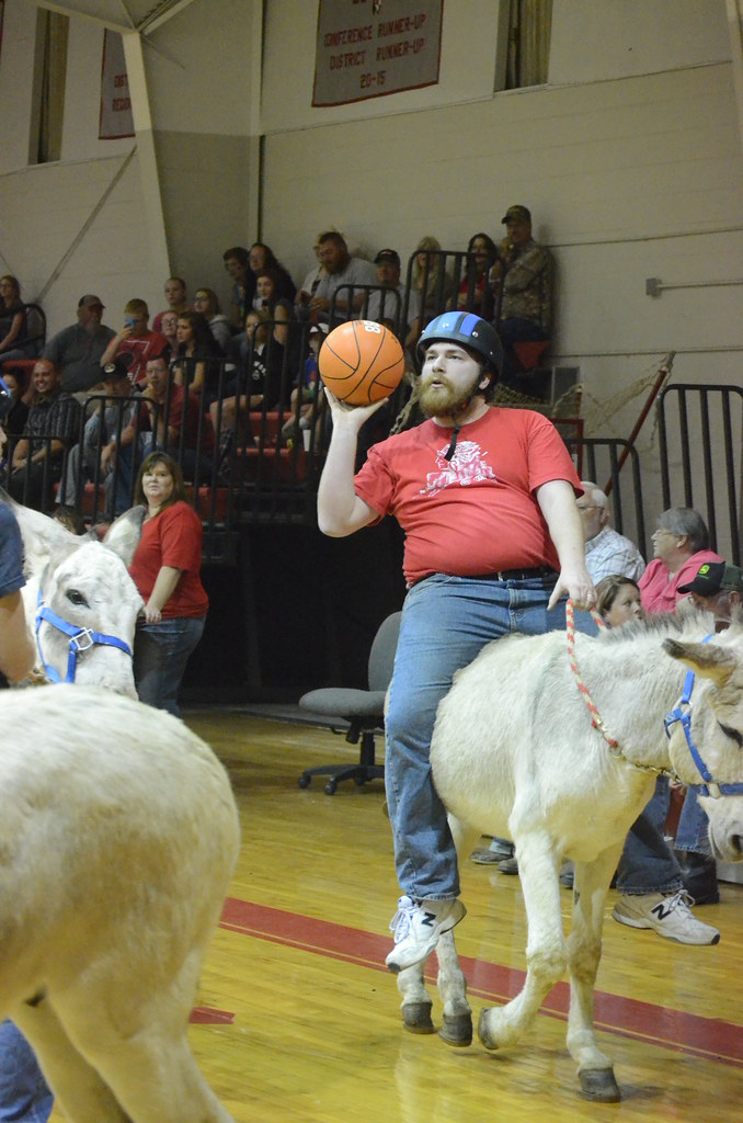  A staff member has his donkey in control as he is about to score.