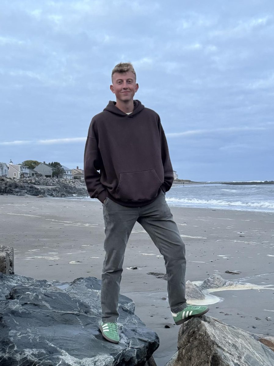 Kody Trude, a avid traveler, is pictured posing at the beach.