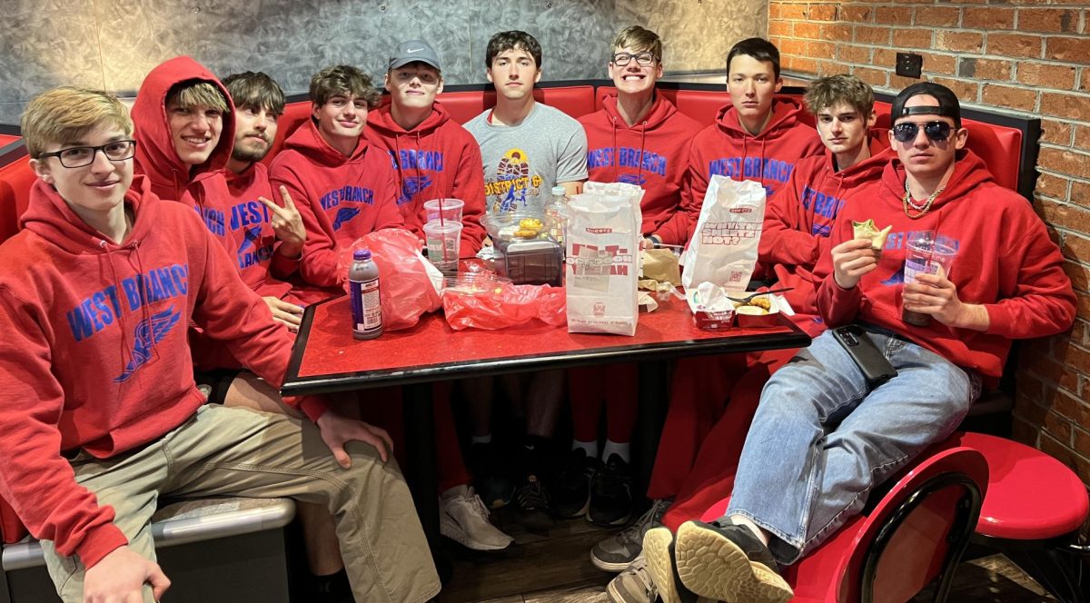 Boys 2024 track members eating Sheetz after a meet.