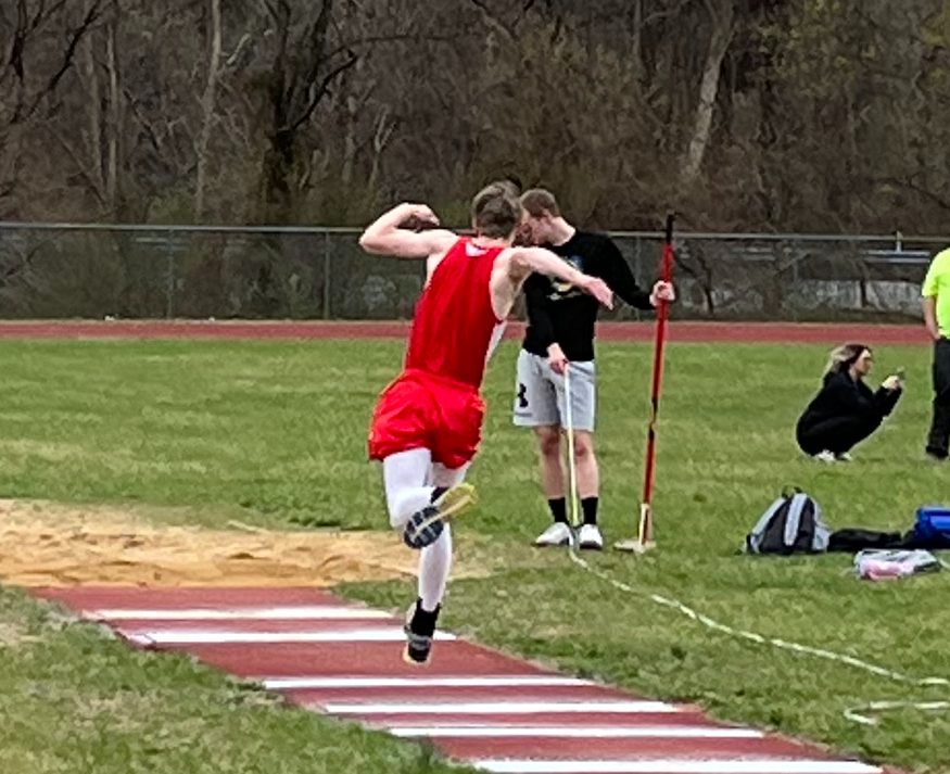 Robert Walker doing the triple jump against the Mount Union Trojans