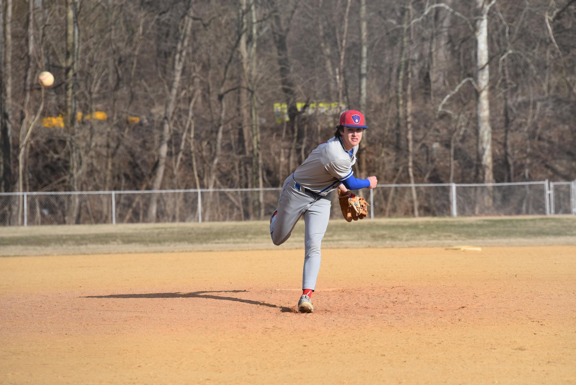 Lukas Colton winds up and releases the pitch to the batter.