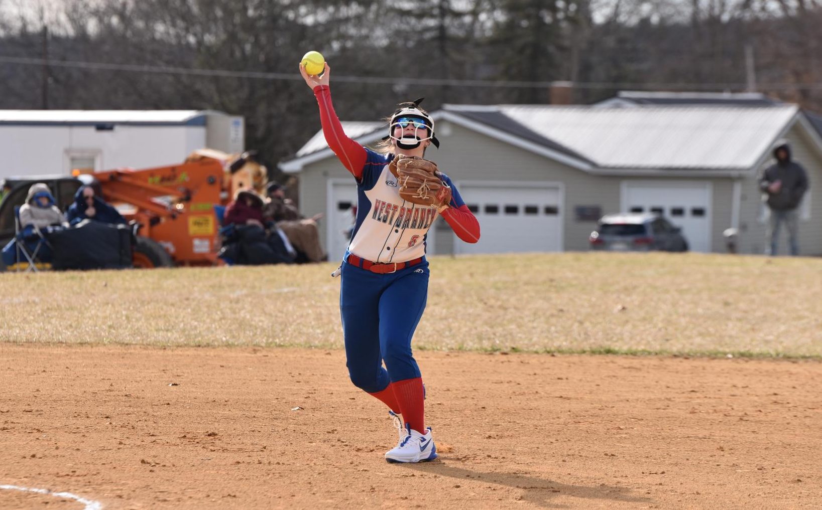 Thompson makes a play by throwing the ball to first base.