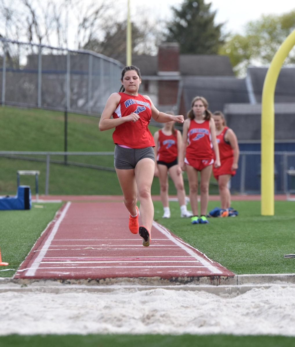 Yingling competing in the long jump event against the Philipsburg-Osceola Mounties