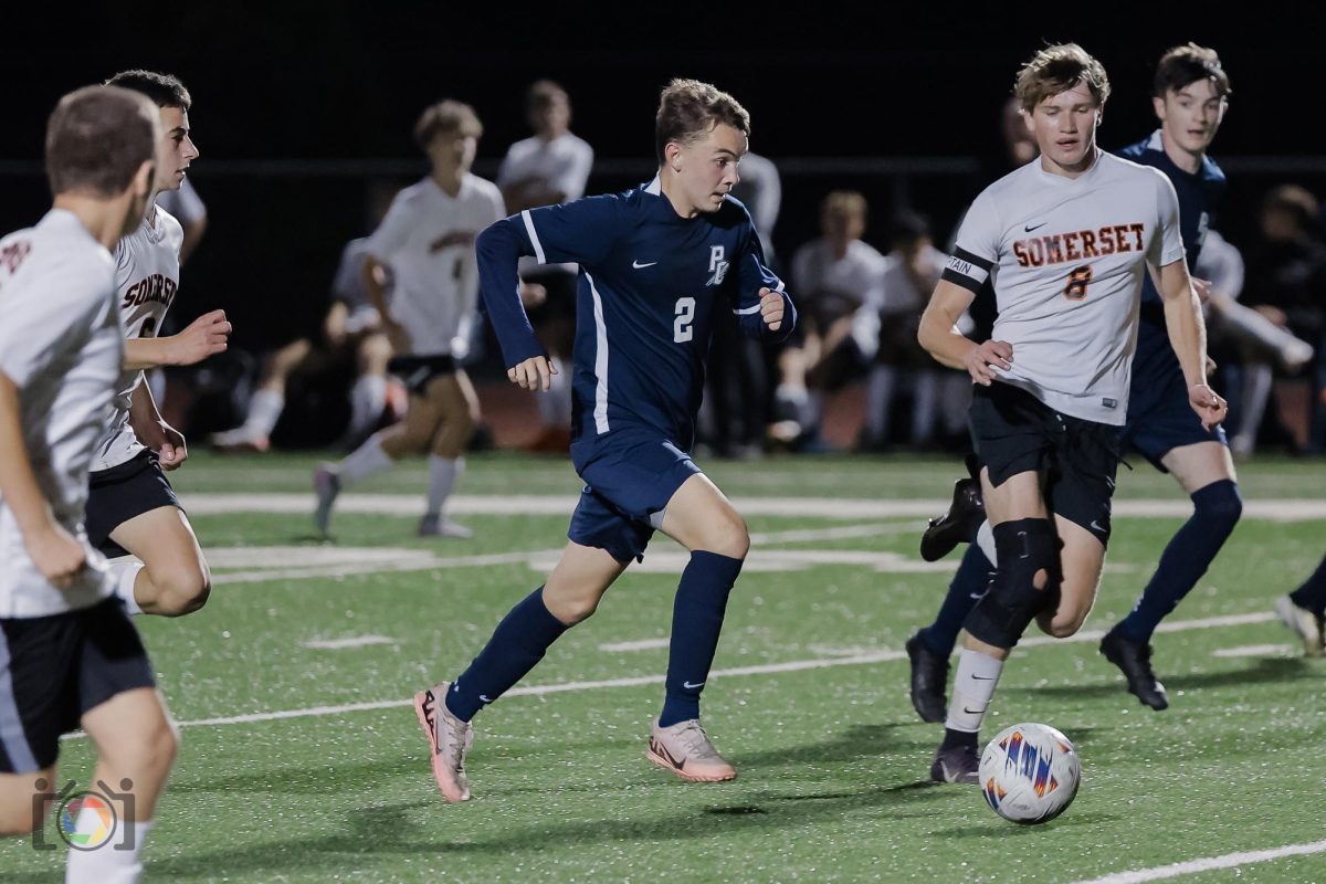 Sophomore Cale McDowell runs down the field trying to score.