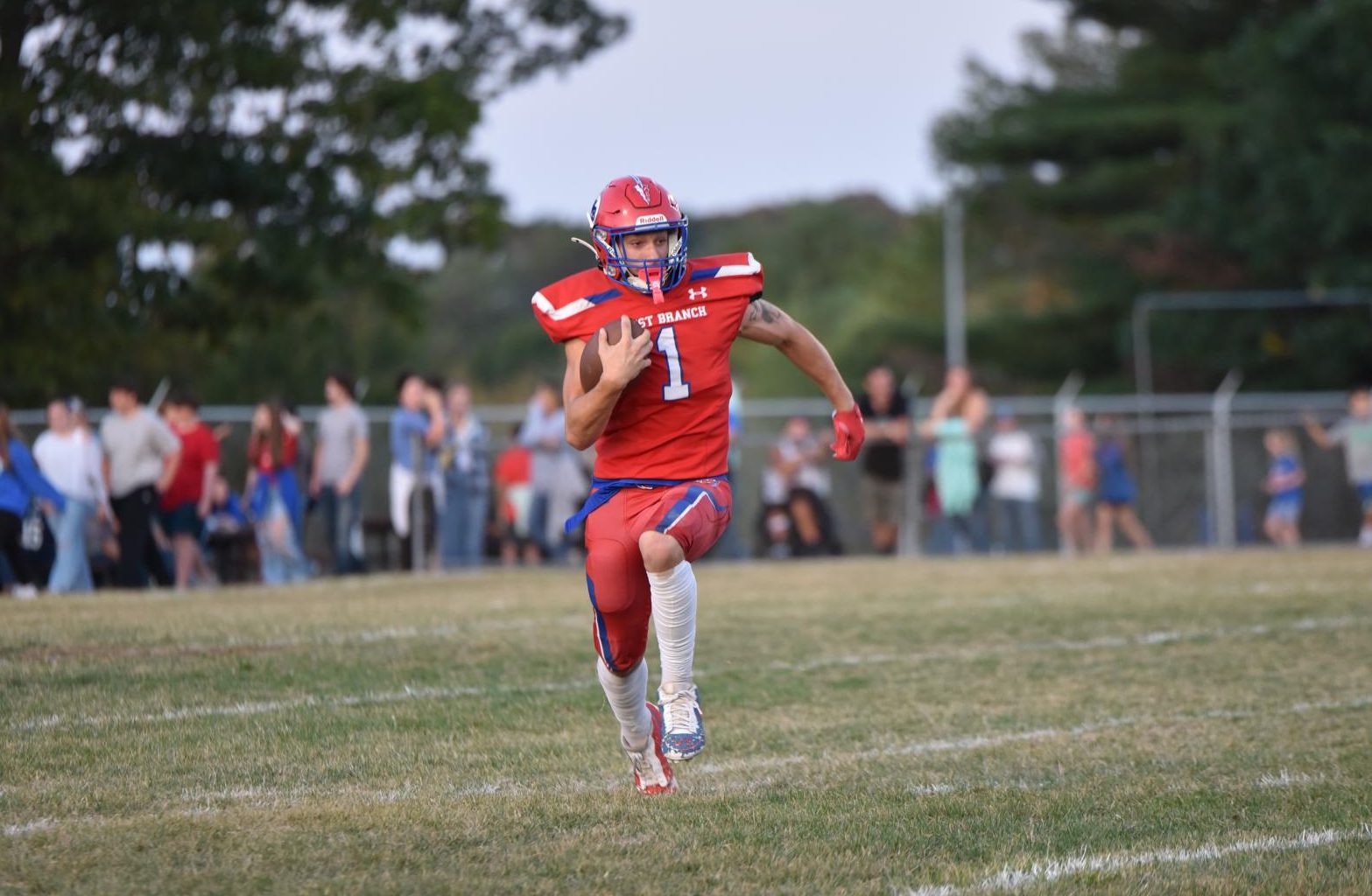 After fielding the punt, Frankie Leskovansky looks for open space.