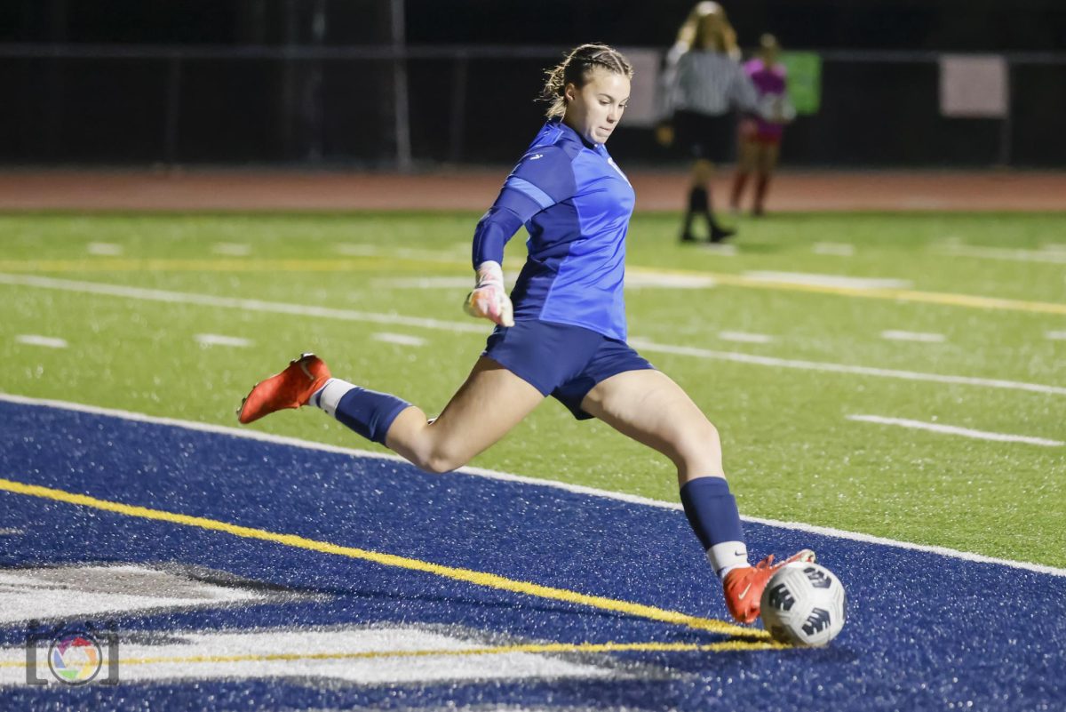 Alexa Prestash gets ready to kick the ball out of the goal area.