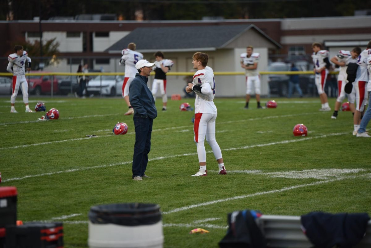 Brayden Willamson talks to his dad pre-game before the first start back.