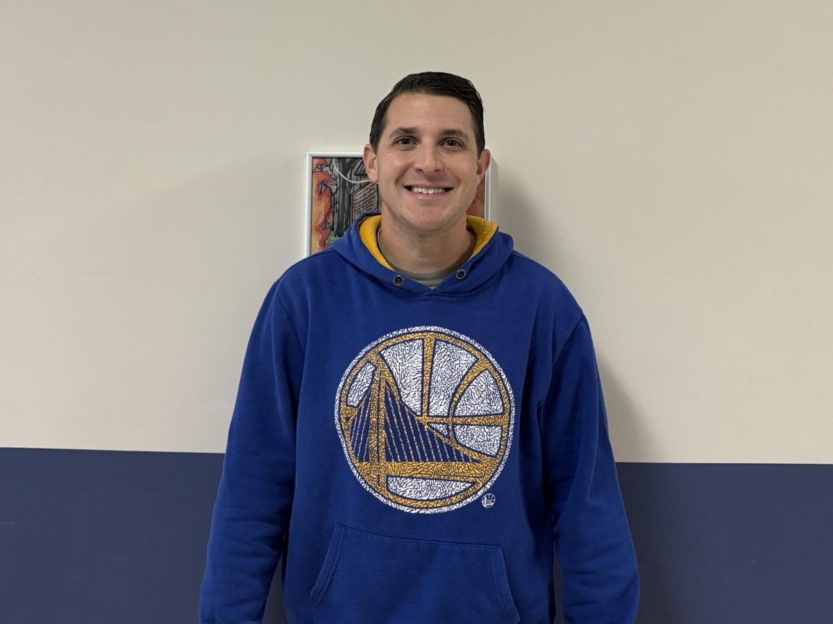 Danny Clark shares a smile outside the library during his study hall. 




