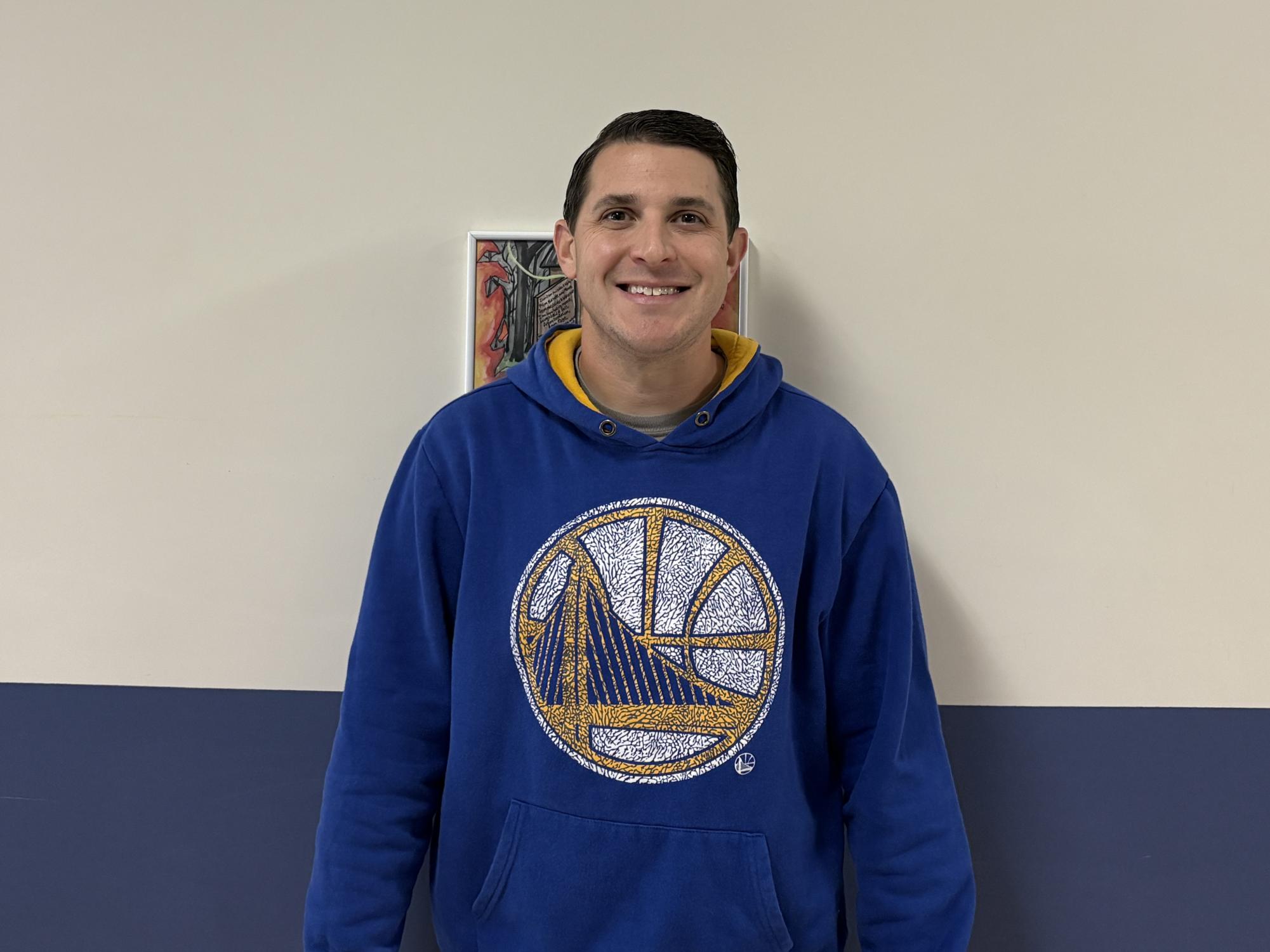 Danny Clark shares a smile outside the library during his study hall. 




