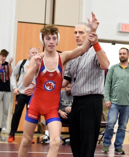 William Edwards celebrates after winning his championship match at districts.