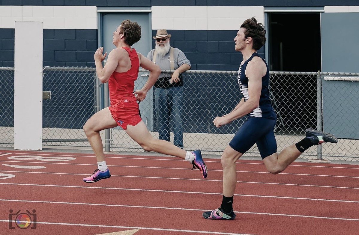 Easton Emigh passes a runner during his race at the Philipsburg-Osceola meet.
