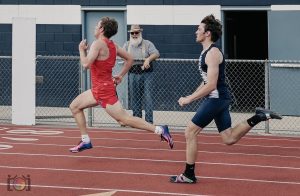 Easton Emigh passes a runner during his race at the Philipsburg-Osceola meet.
