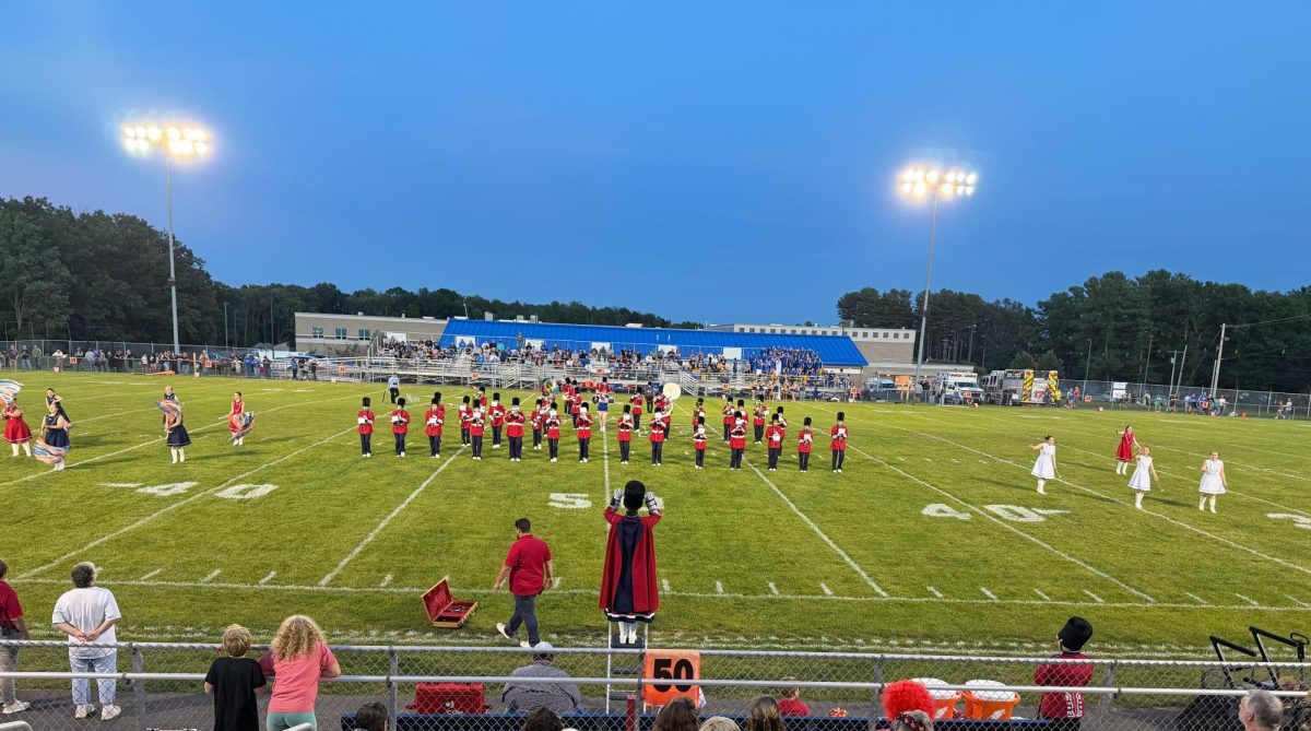 The West Branch Warrior Band performs its Jimmy Eat World-inspired show on the football field before kickoff.