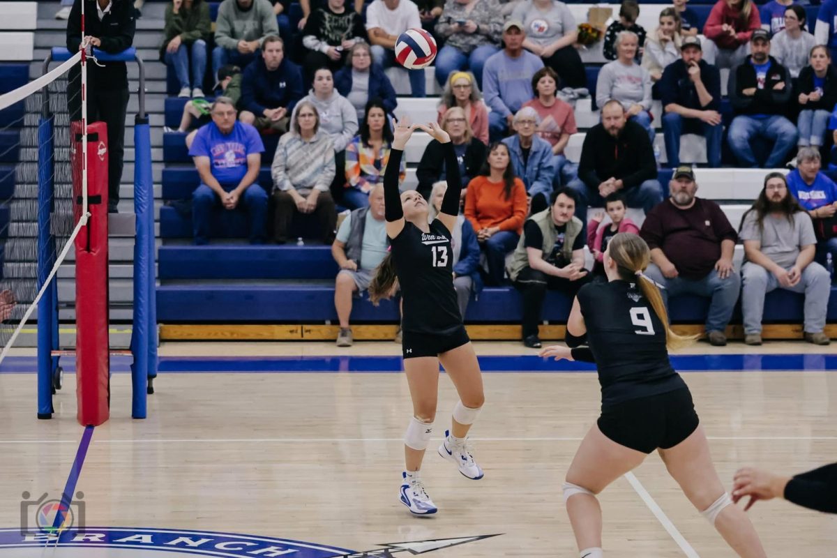 Alexis Bush sets the ball to middle hitter Kayli Thompson in a 3-1 victory over Juniata Valley.
