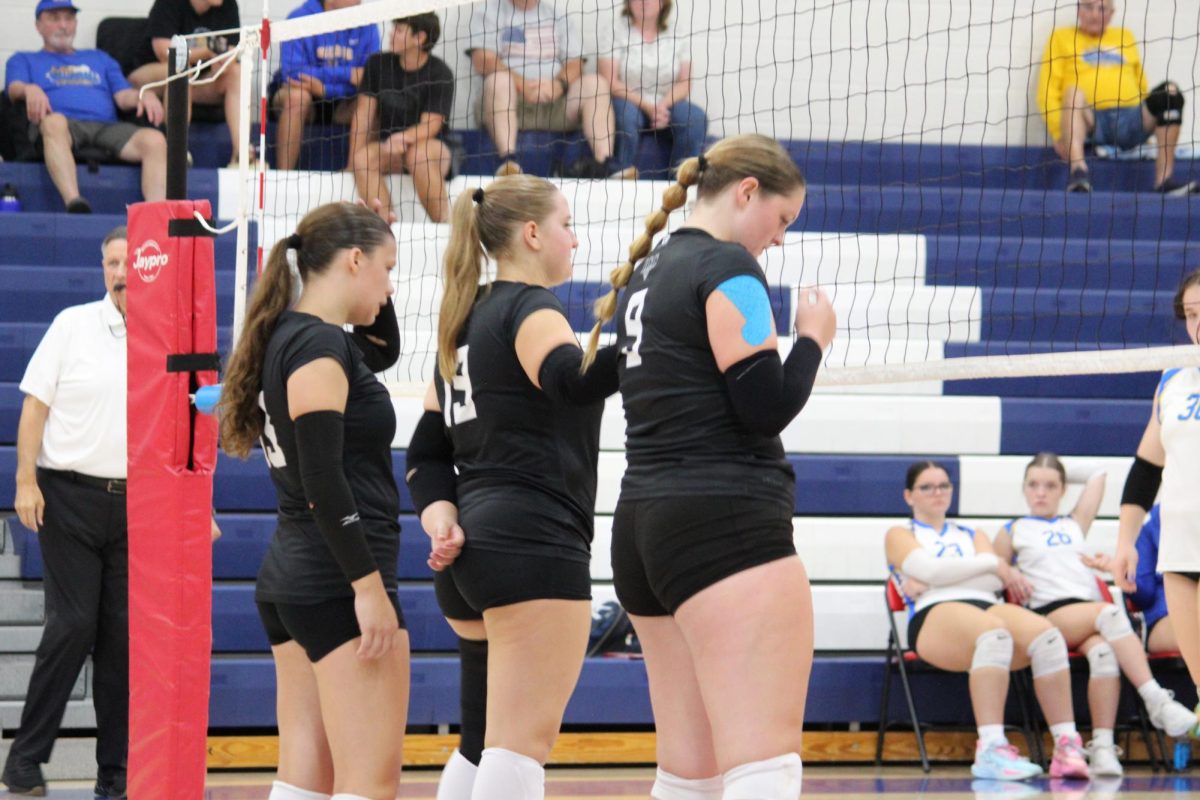 Front row gets ready as the serve goes over the net.




Image credit: Megan Eyerly